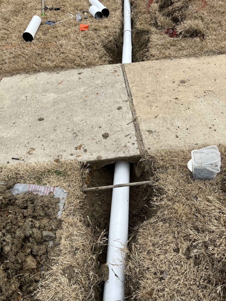 drainage under sidewalk